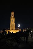 SX30161-2 Belfry tower and horse drawn carriages at night.jpg